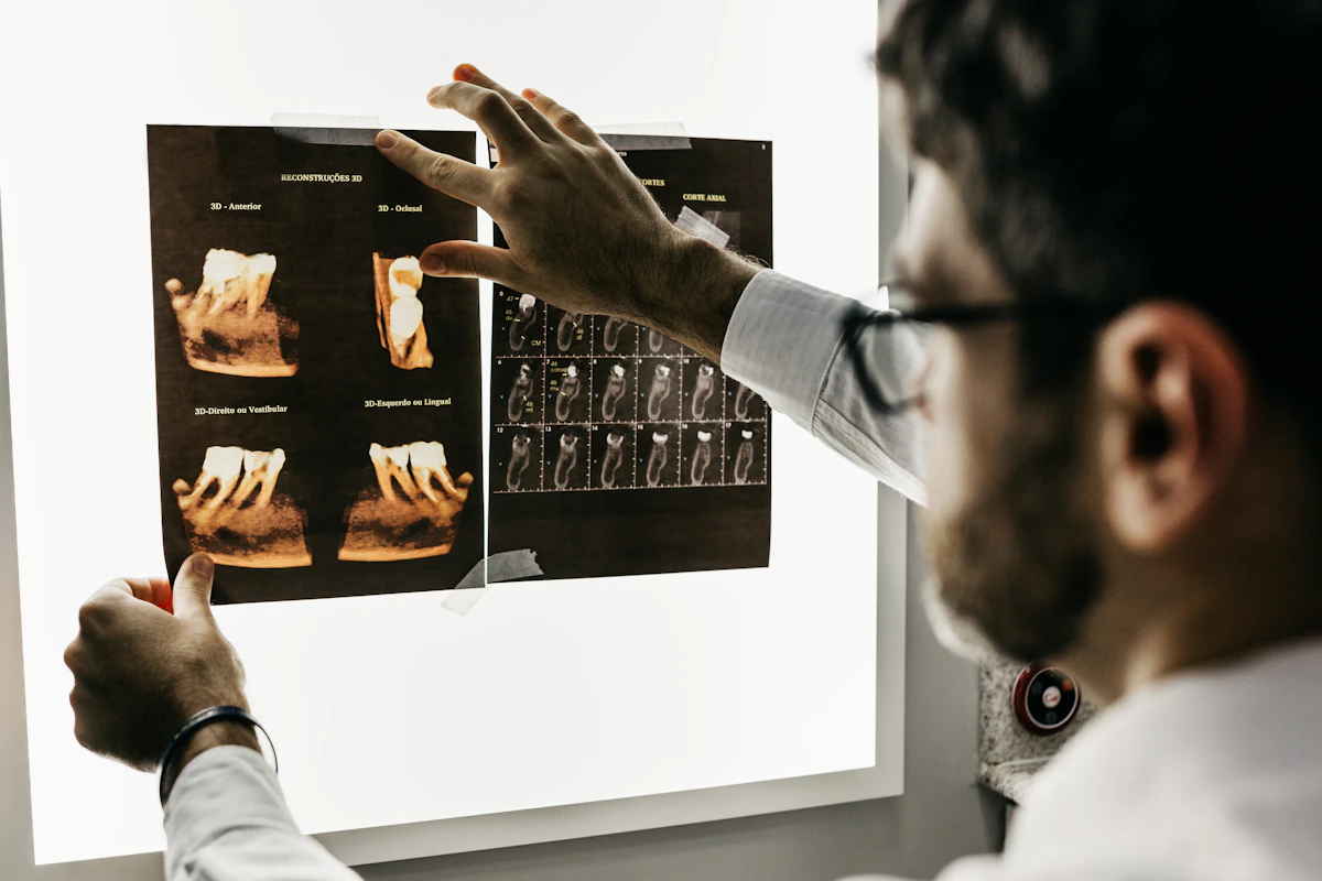 Clinical dental scans and X-rays demonstrating tooth movement through alveolar bone and jaw alignment